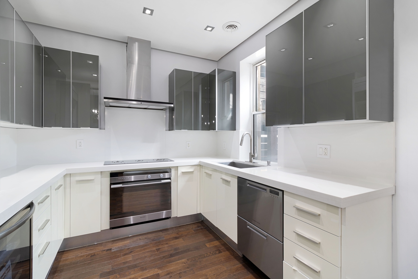 Undisclosed Address Chicago, IL 60607 - Photo 9 of 17 a kitchen with a sink stove and cabinets