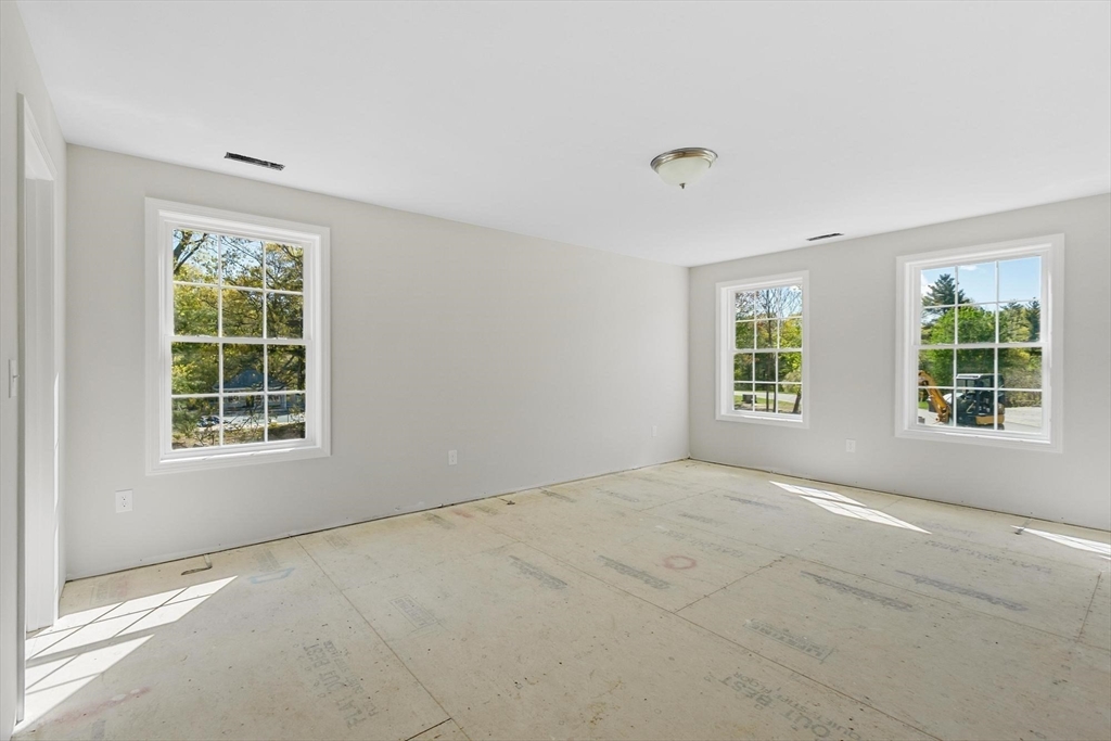 22 Benoit Avenue Pelham, NH 03076 - Photo 17 of 42 an empty room with windows