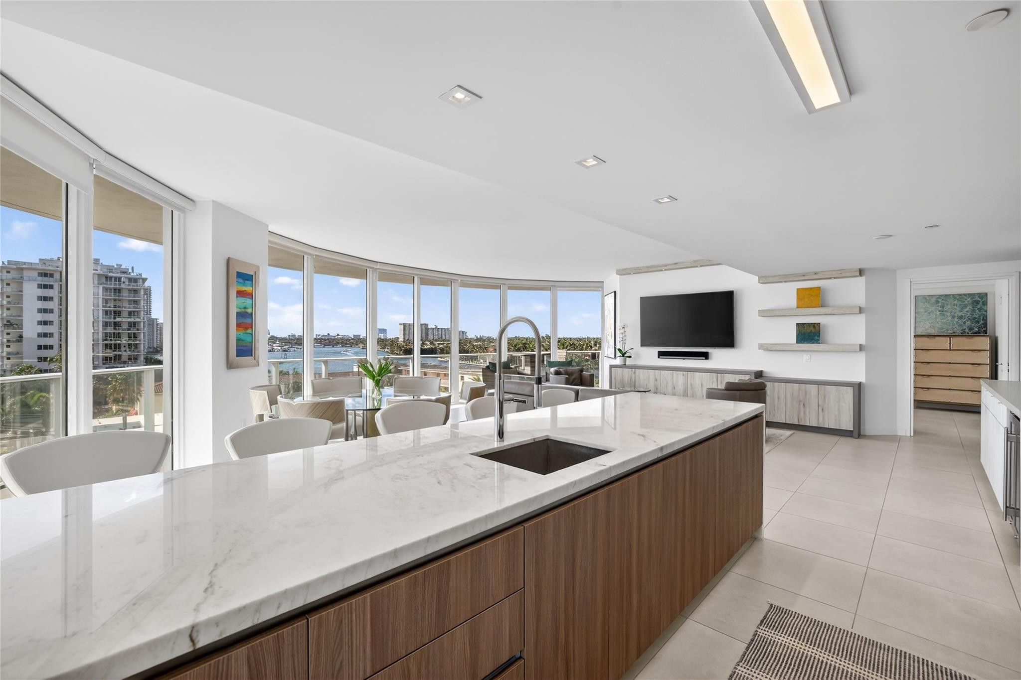 401 North Birch Road, Unit 600 Fort Lauderdale, FL 33304 - Photo 11 of 47 a kitchen with lots of counter top space and living room