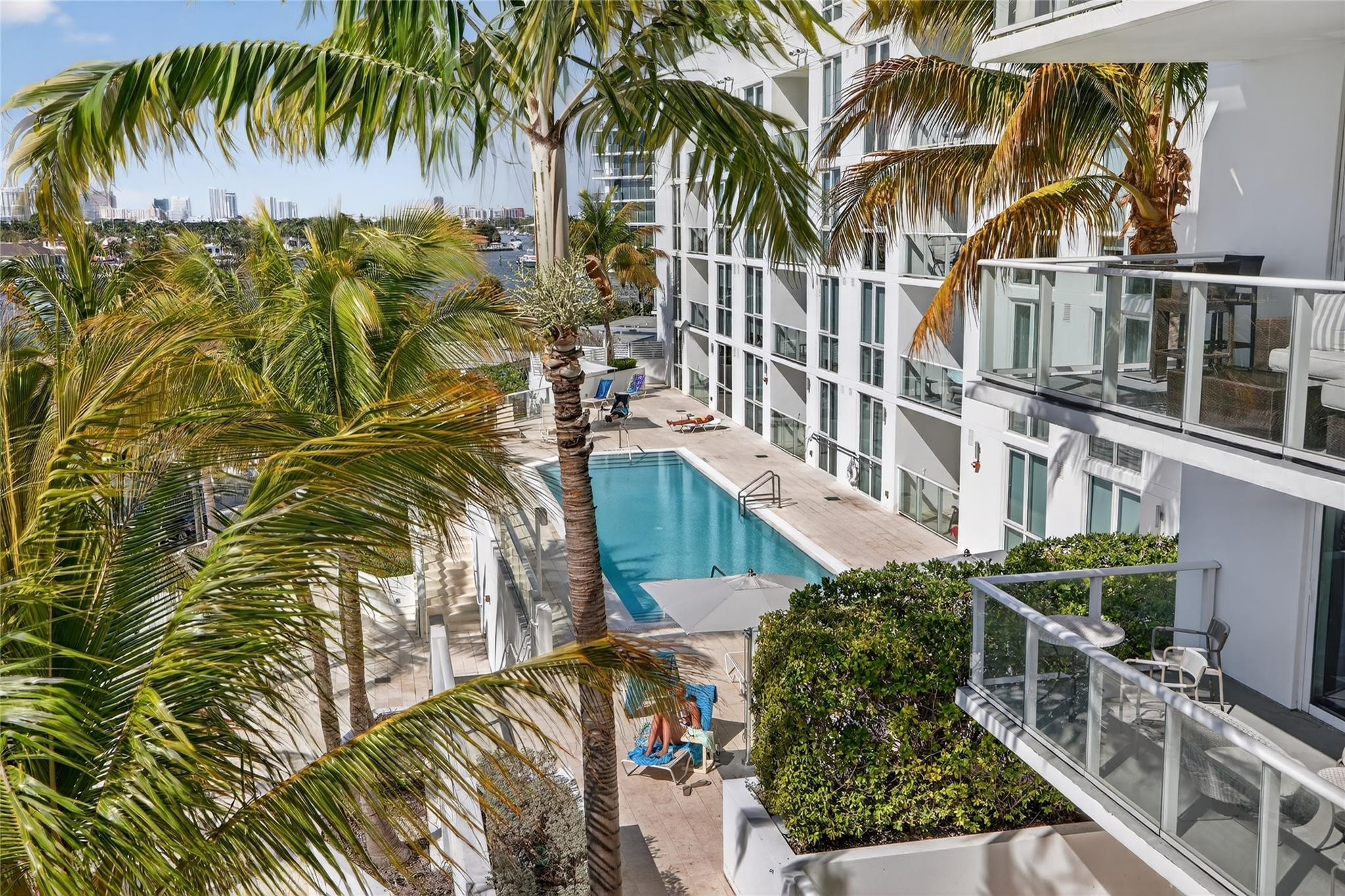 401 North Birch Road, Unit 600 Fort Lauderdale, FL 33304 - Photo 12 of 47 a view of balcony with wooden floor and palm trees