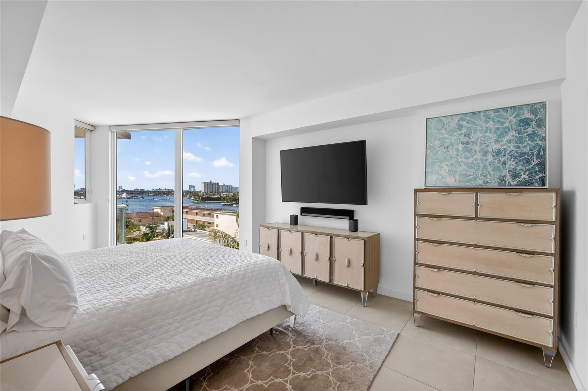401 North Birch Road, Unit 600 Fort Lauderdale, FL 33304 - Photo 14 of 47 a bedroom with a bed and a flat screen tv