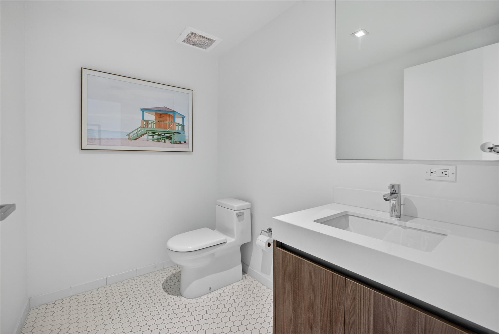 401 North Birch Road, Unit 600 Fort Lauderdale, FL 33304 - Photo 20 of 47 a bathroom with a sink a toilet and a mirror