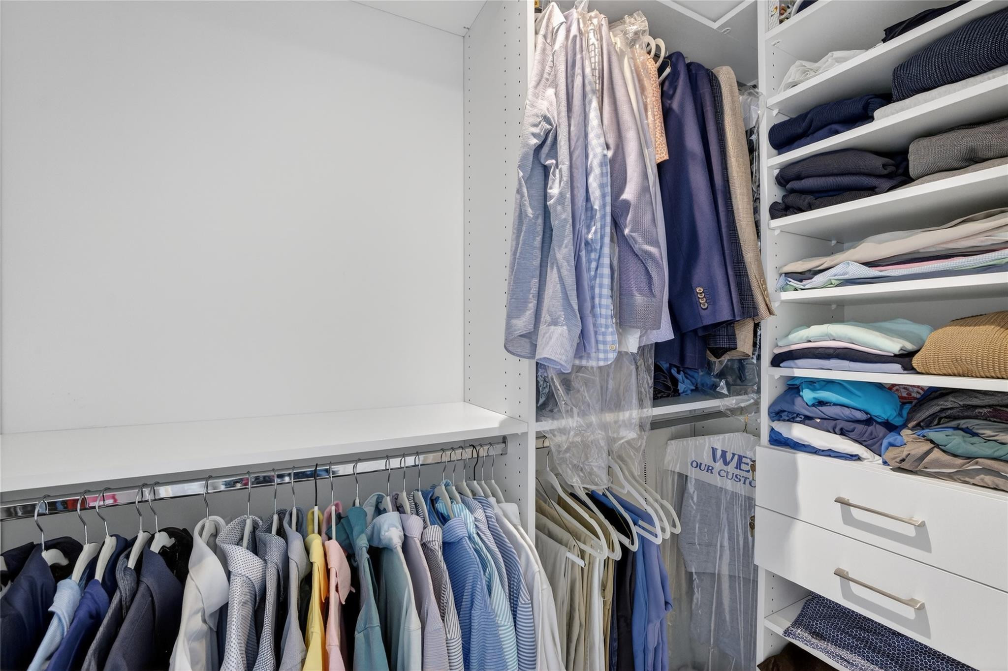 401 North Birch Road, Unit 600 Fort Lauderdale, FL 33304 - Photo 21 of 47 a view of walk in closet with clothes and shoes