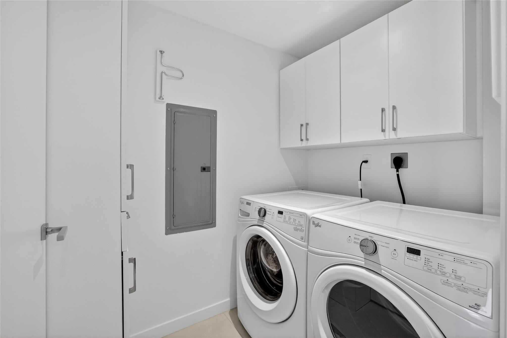401 North Birch Road, Unit 600 Fort Lauderdale, FL 33304 - Photo 26 of 47 a utility room with dryer and washer