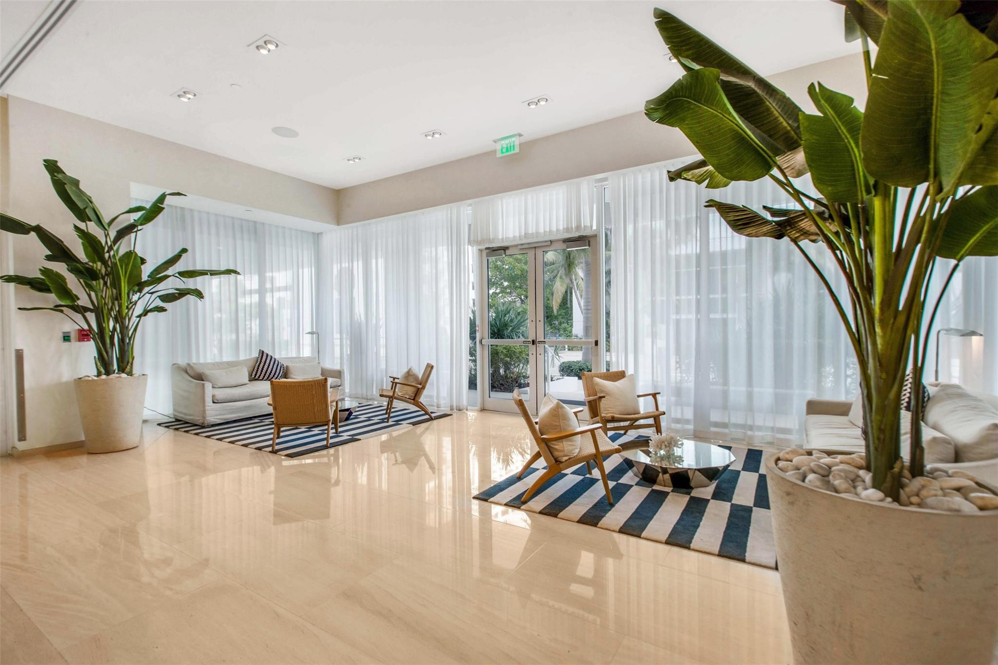 401 North Birch Road, Unit 600 Fort Lauderdale, FL 33304 - Photo 32 of 47 a view of living room with patio furniture and floor to ceiling window