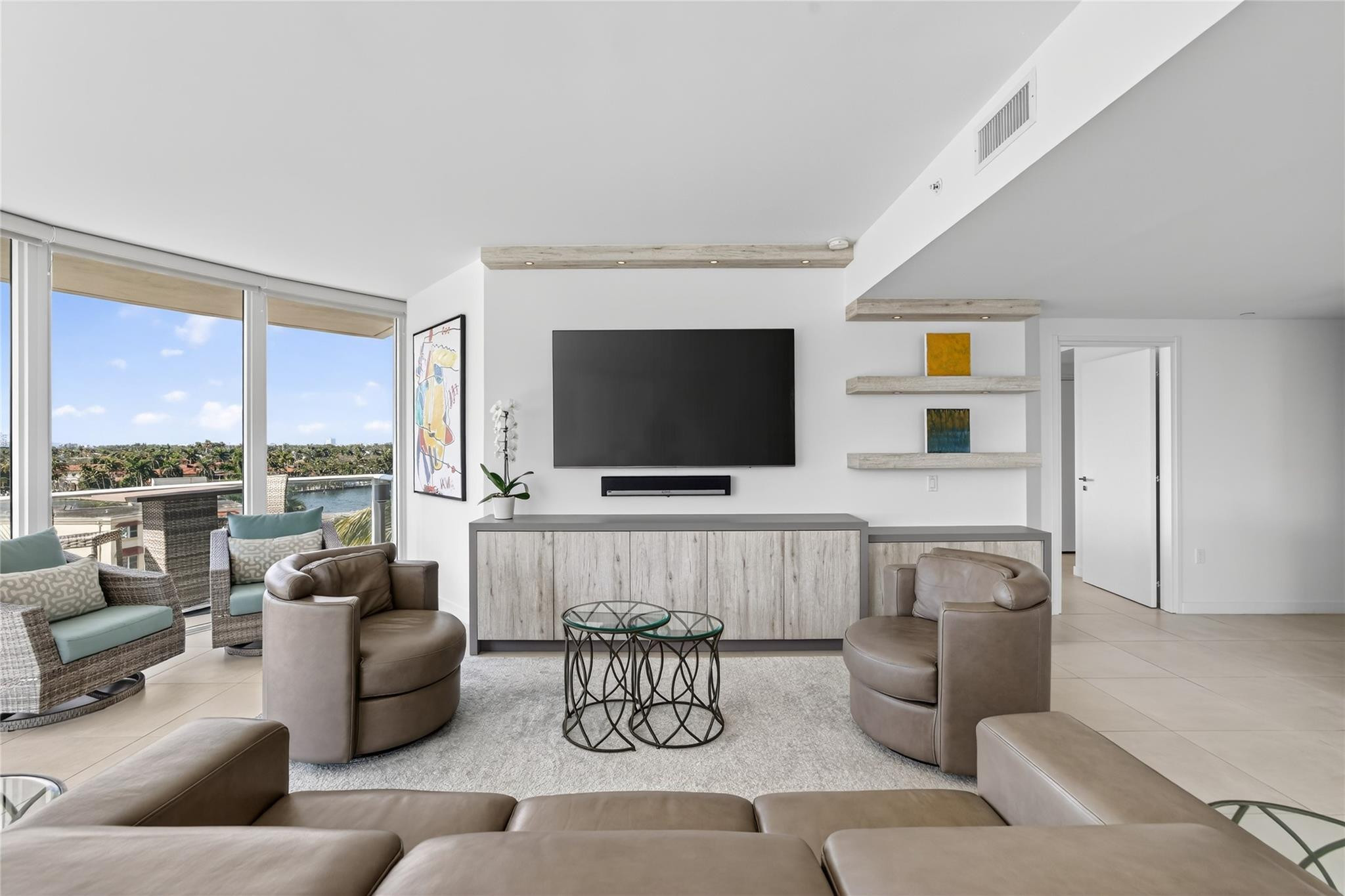 401 North Birch Road, Unit 600 Fort Lauderdale, FL 33304 - Photo 4 of 47 a living room with furniture and a flat screen tv