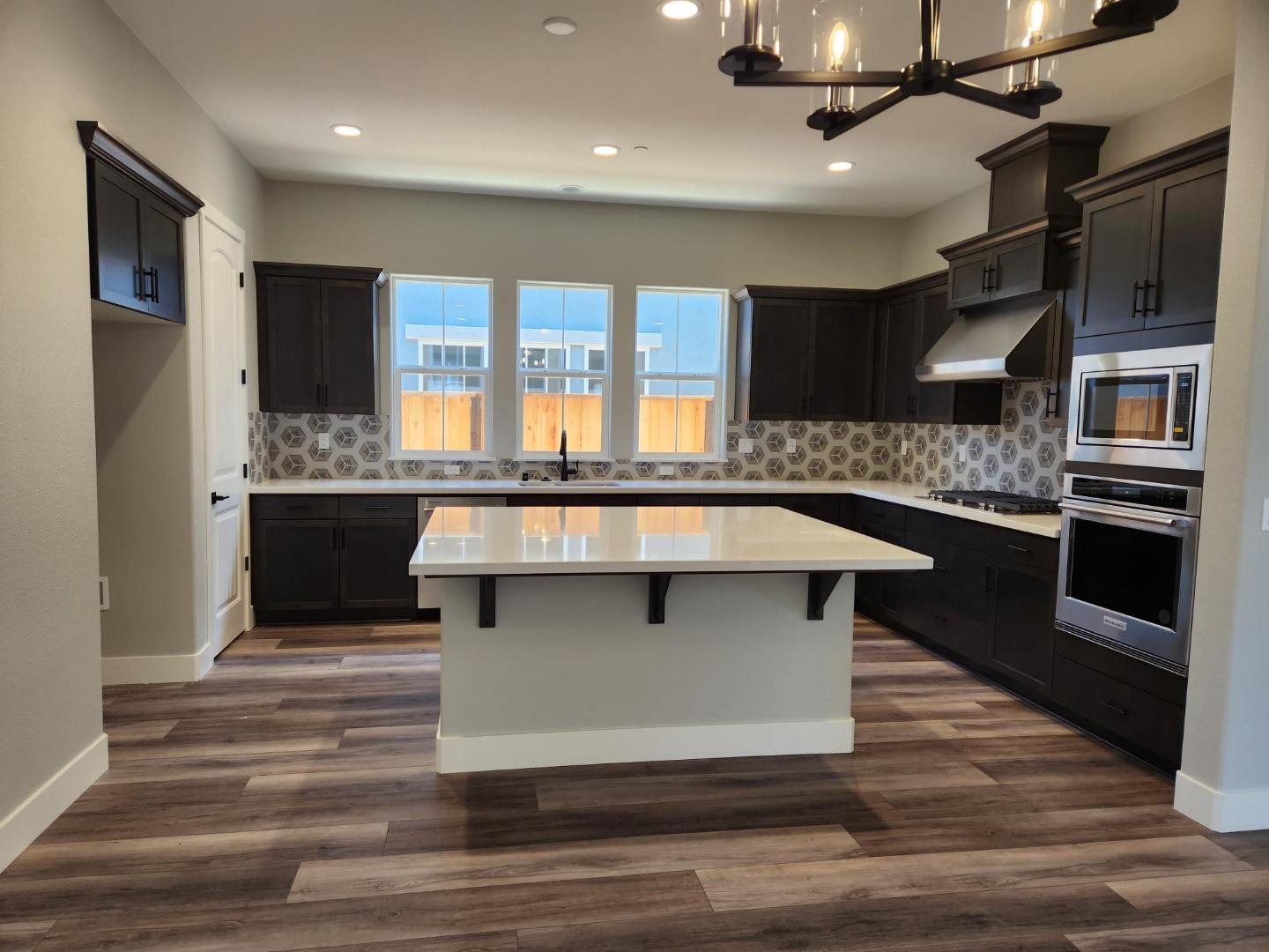3003 Shasta Way Marina, CA 93933 - Photo 3 of 15 a kitchen with stainless steel appliances granite countertop a stove and a refrigerator