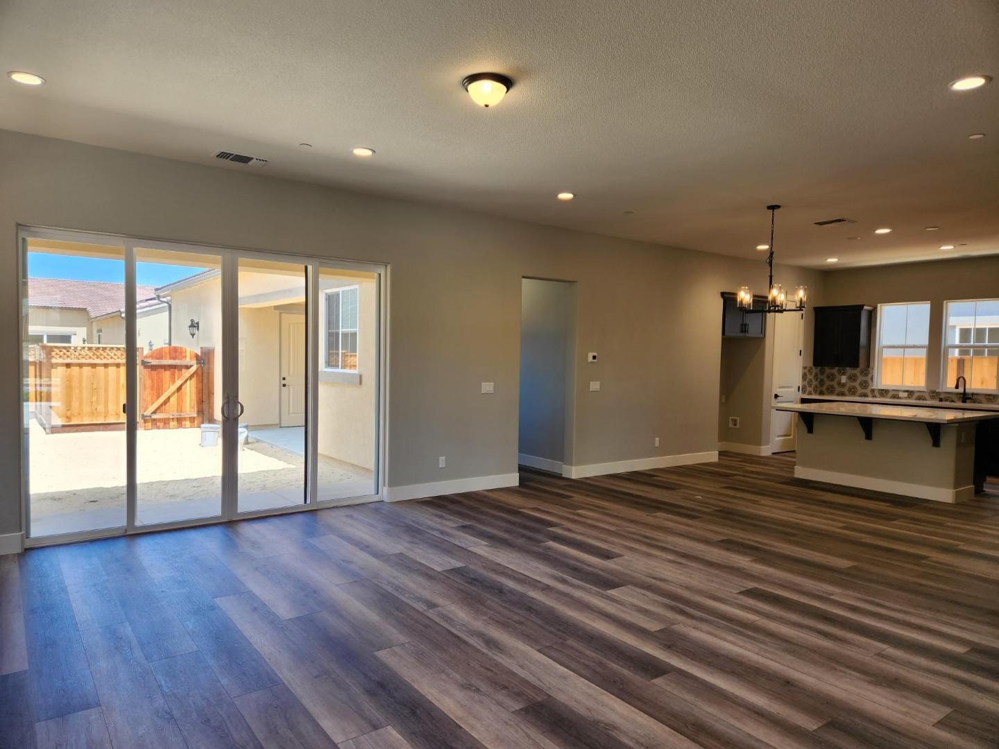 3003 Shasta Way Marina, CA 93933 - Photo 4 of 15 an empty room with wooden floor and windows