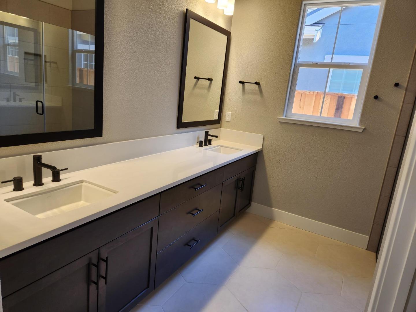 3003 Shasta Way Marina, CA 93933 - Photo 7 of 15 a bathroom with a double vanity sink and mirror