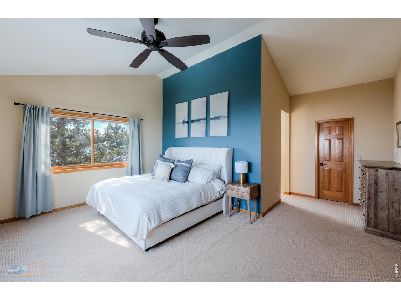 84 Canon View Road Boulder, CO 80302 - Photo 17 of 33 a living room with a bed furniture and a large window