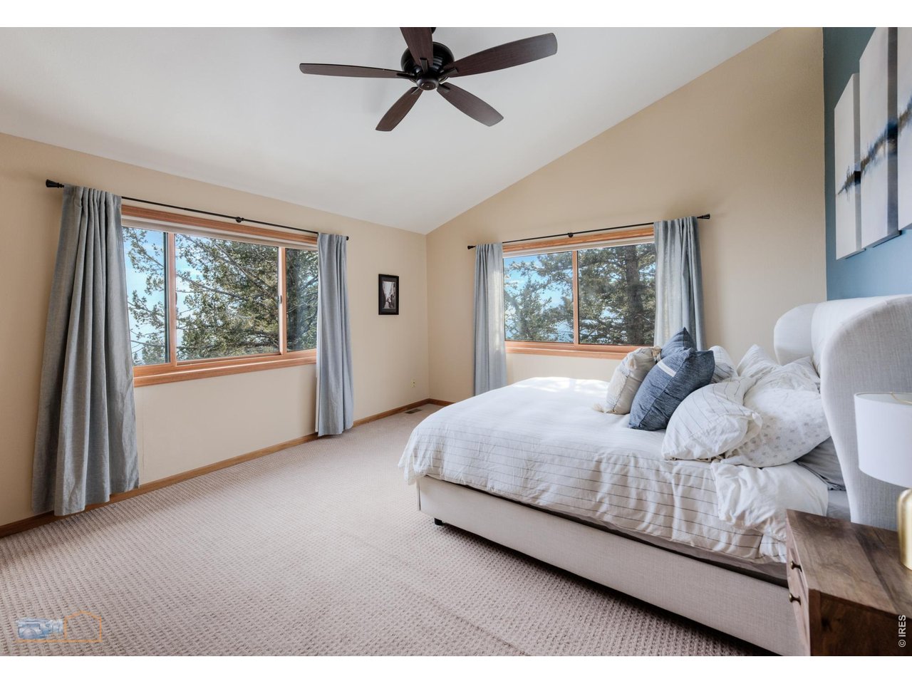 84 Canon View Road Boulder, CO 80302 - Photo 18 of 33 a bedroom with a large bed and a window