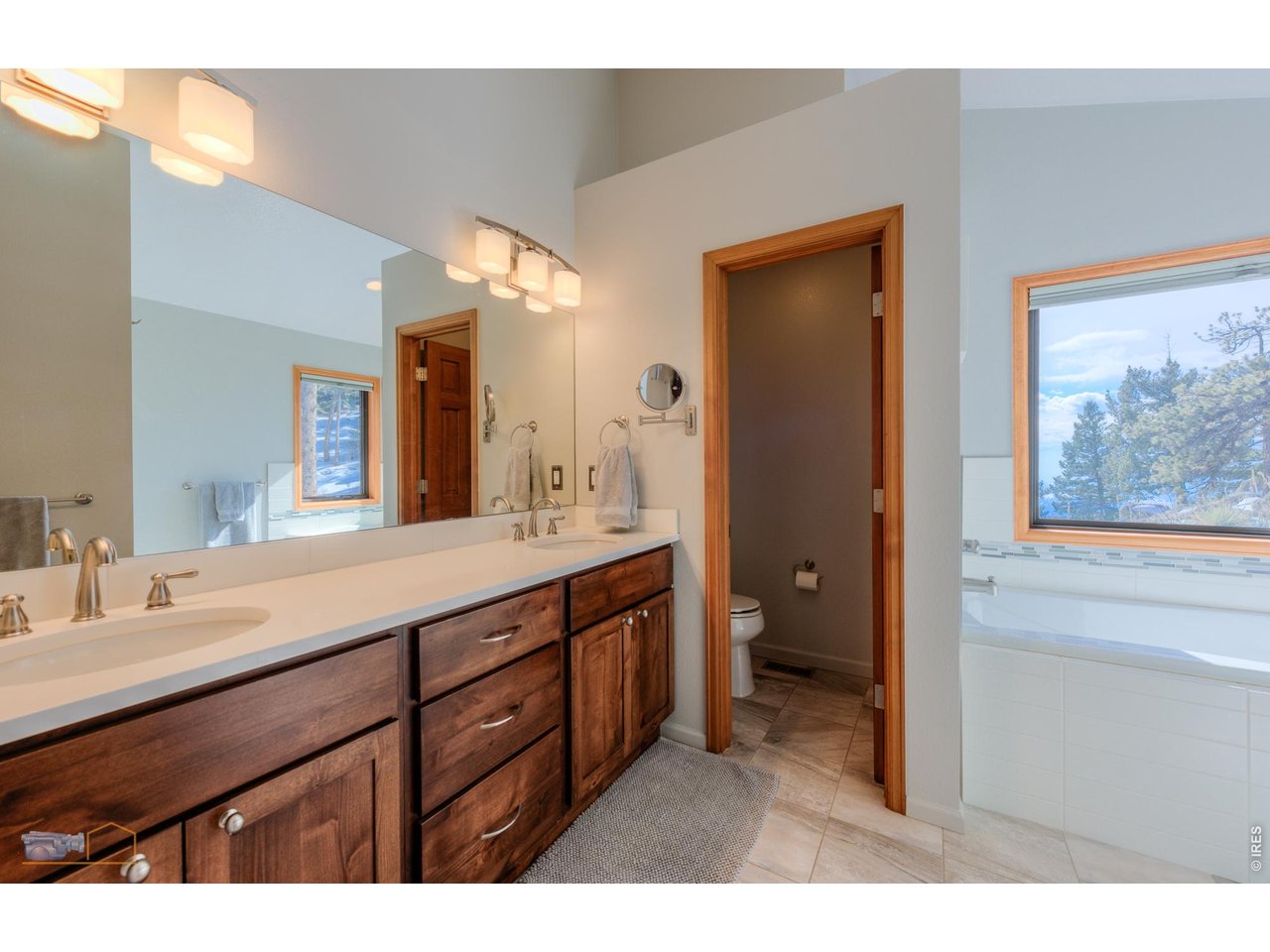 84 Canon View Road Boulder, CO 80302 - Photo 20 of 33 a bathroom with a double vanity sink and a mirror