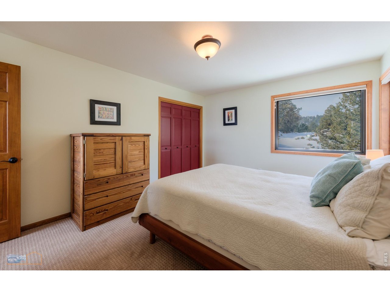 84 Canon View Road Boulder, CO 80302 - Photo 22 of 33 a bedroom with a bed and a dresser