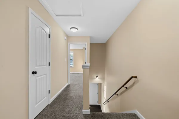 a view of a hallway with staircase