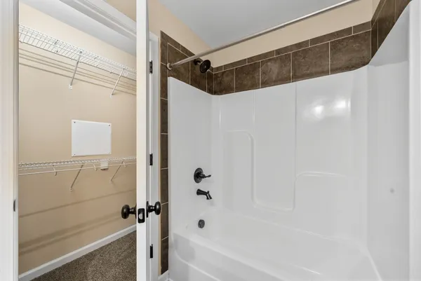a bathroom with a shower and a shower