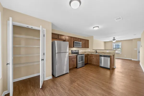 a kitchen with stainless steel appliances a refrigerator and a sink