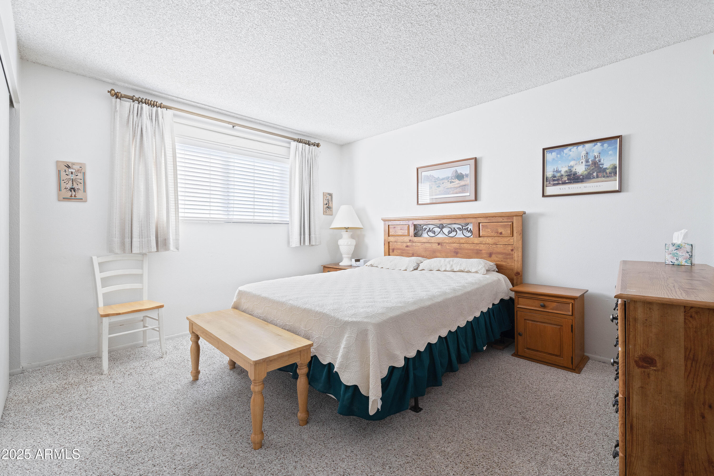 5525 East Thomas Road, Unit N5 Phoenix, AZ 85018 - Photo 11 of 27 a spacious bedroom with a bed and a table in it