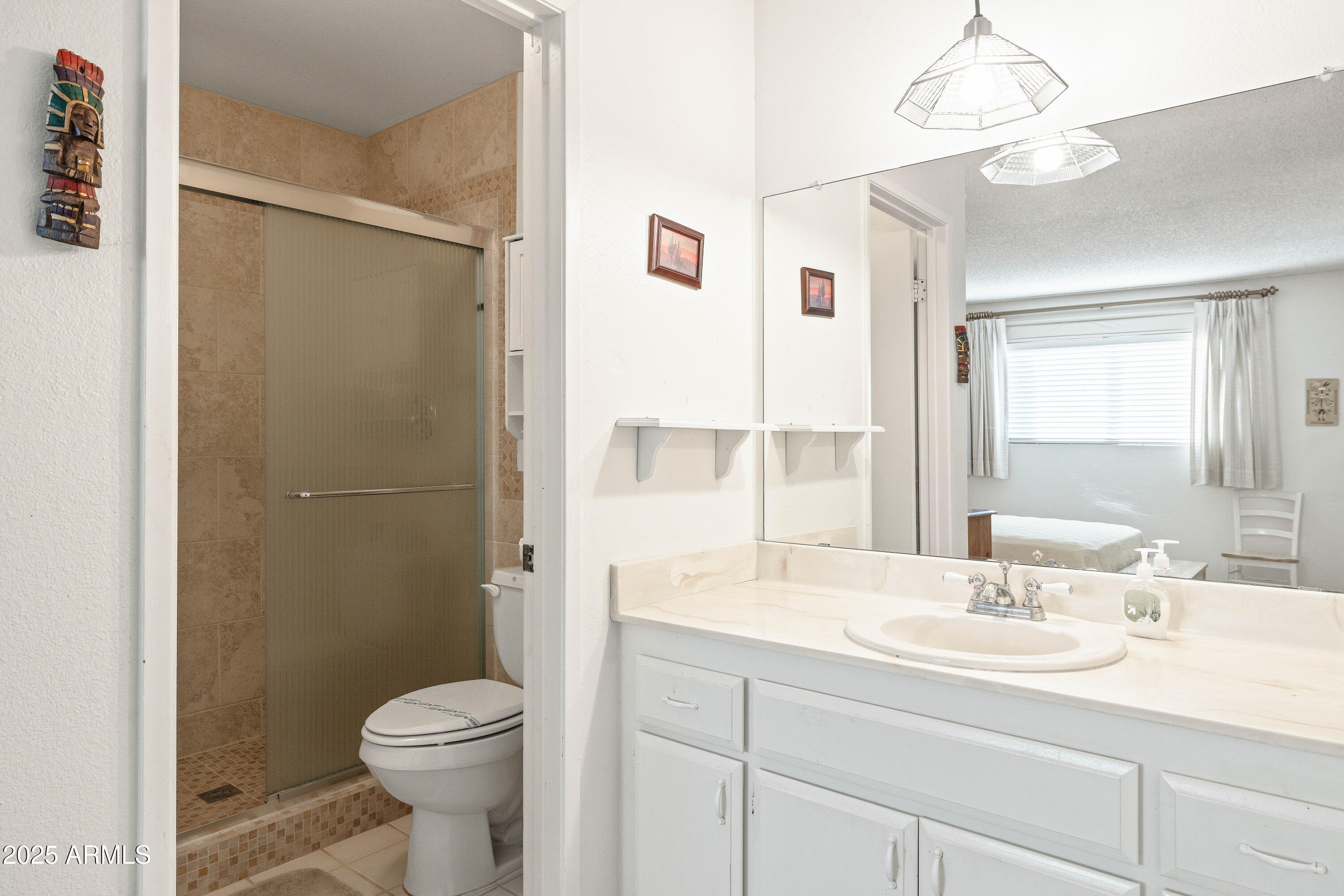 5525 East Thomas Road, Unit N5 Phoenix, AZ 85018 - Photo 13 of 27 a bathroom with a sink a toilet and shower