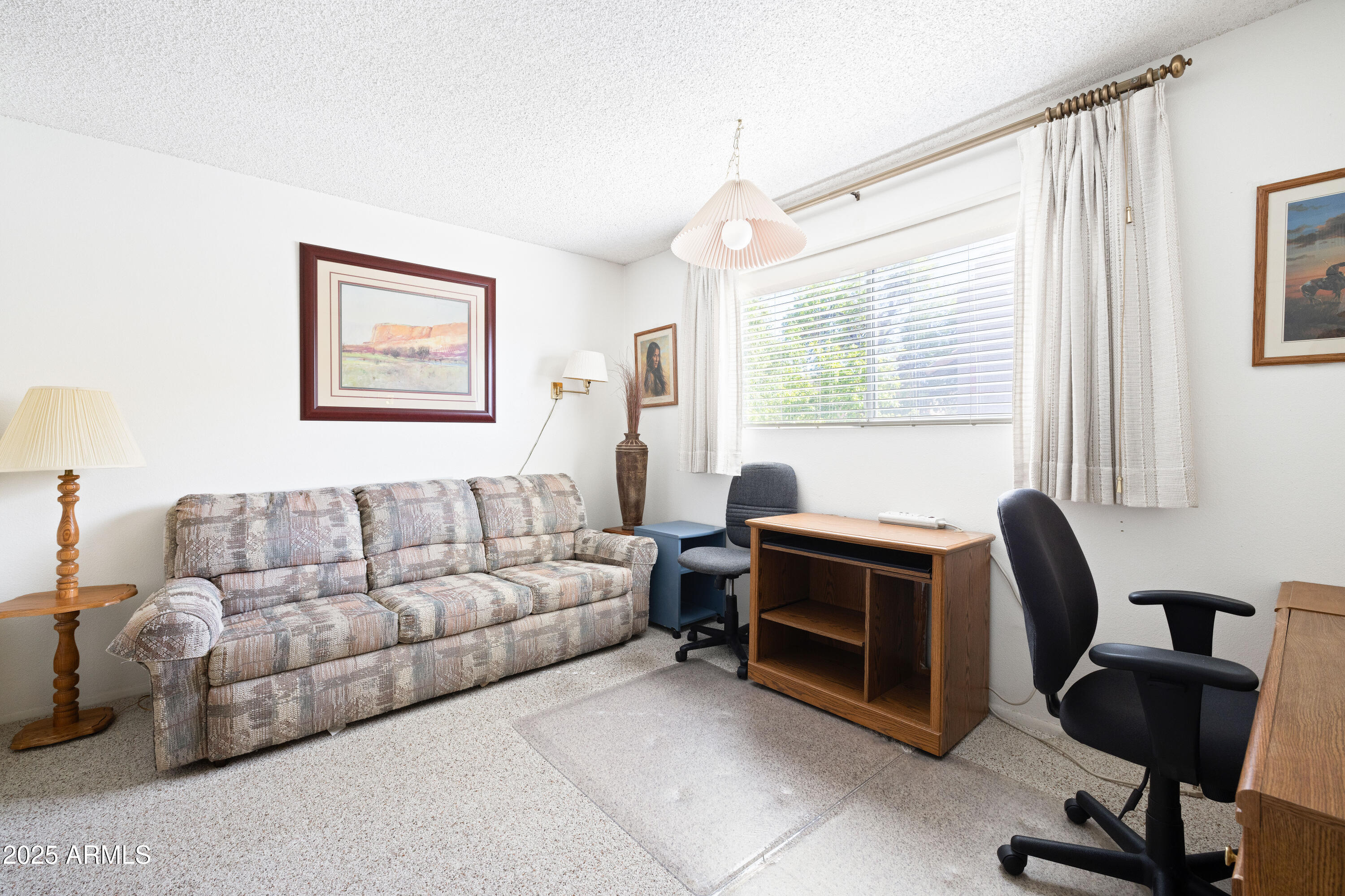5525 East Thomas Road, Unit N5 Phoenix, AZ 85018 - Photo 14 of 27 a living room with furniture and a window
