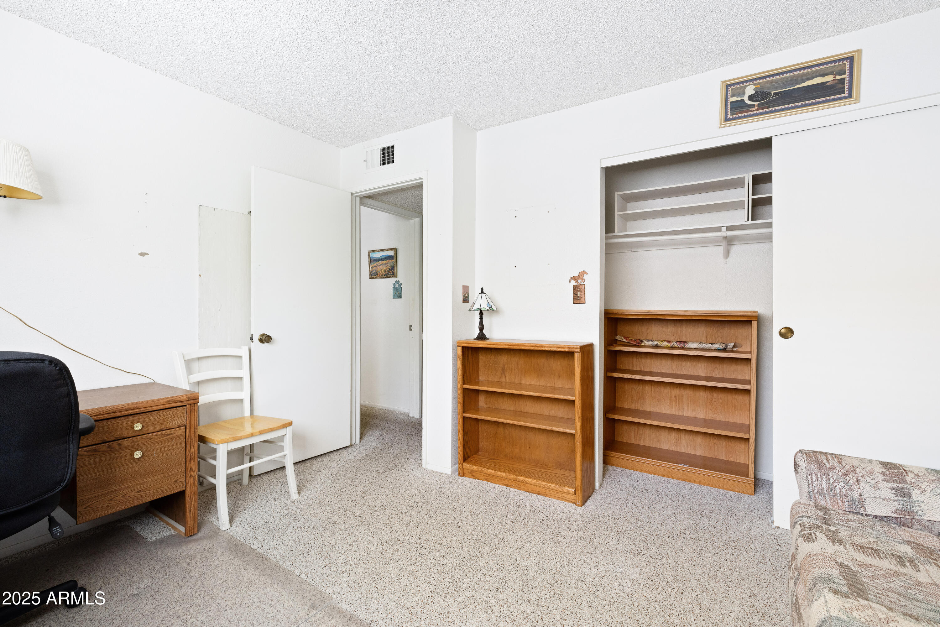 5525 East Thomas Road, Unit N5 Phoenix, AZ 85018 - Photo 15 of 27 a living room with furniture and a dresser