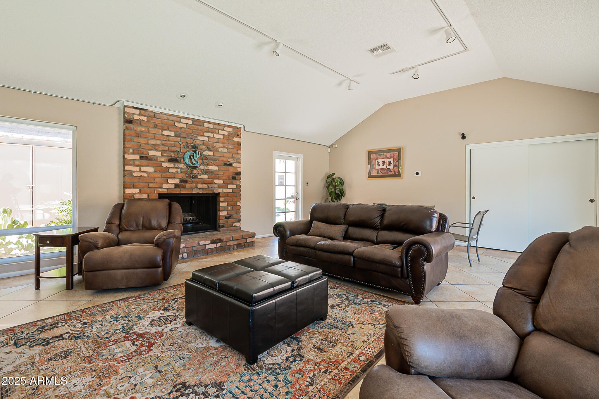 5525 East Thomas Road, Unit N5 Phoenix, AZ 85018 - Photo 20 of 27 a living room with furniture fireplace and a large window