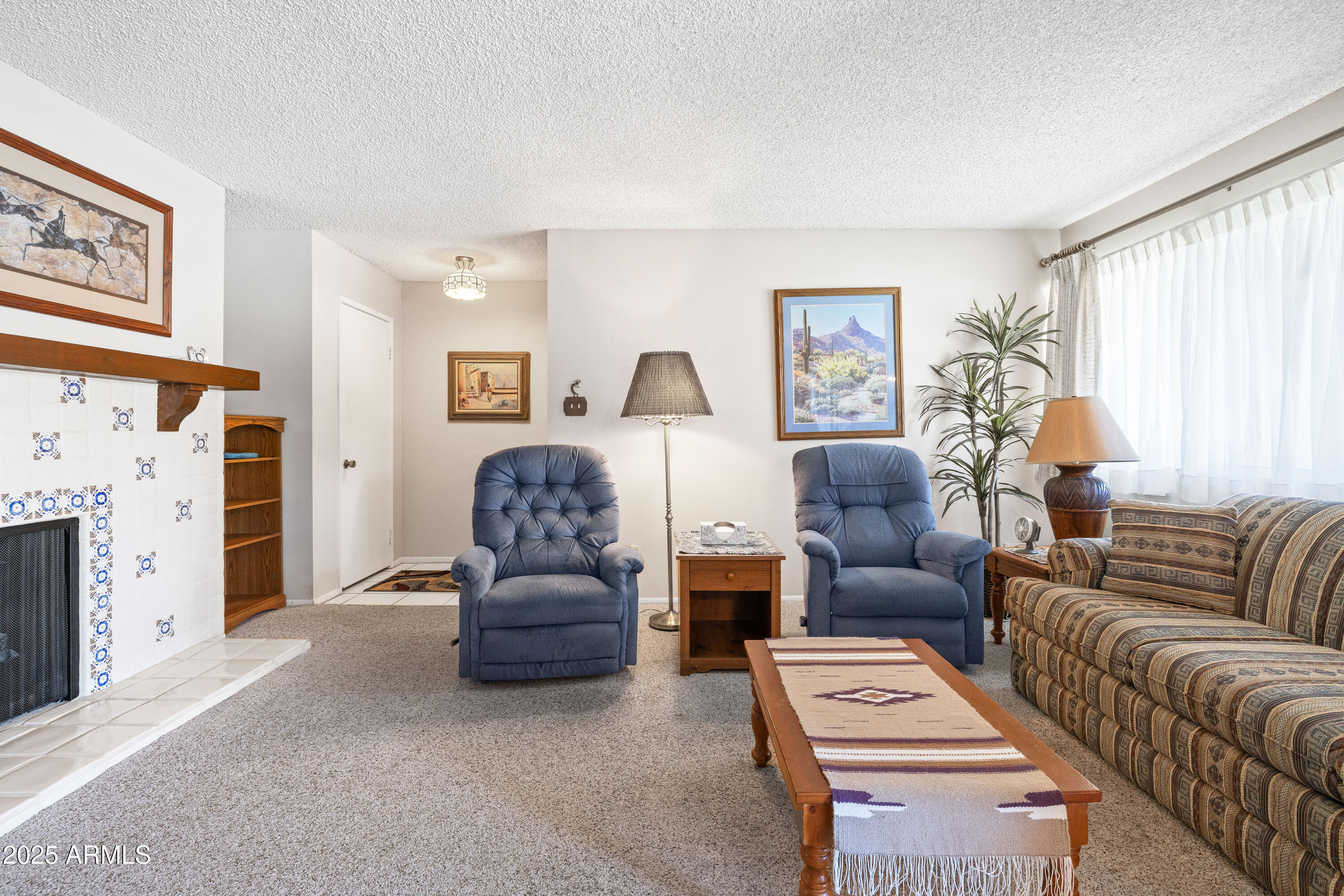 5525 East Thomas Road, Unit N5 Phoenix, AZ 85018 - Photo 3 of 27 a living room with furniture fireplace and a window
