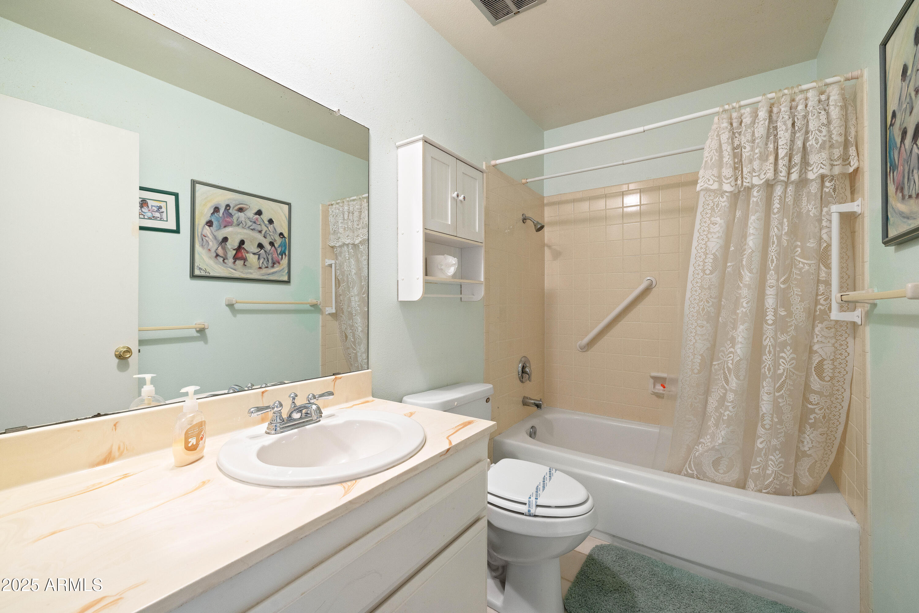 5525 East Thomas Road, Unit N5 Phoenix, AZ 85018 - Photo 9 of 27 a bathroom with a sink toilet and shower