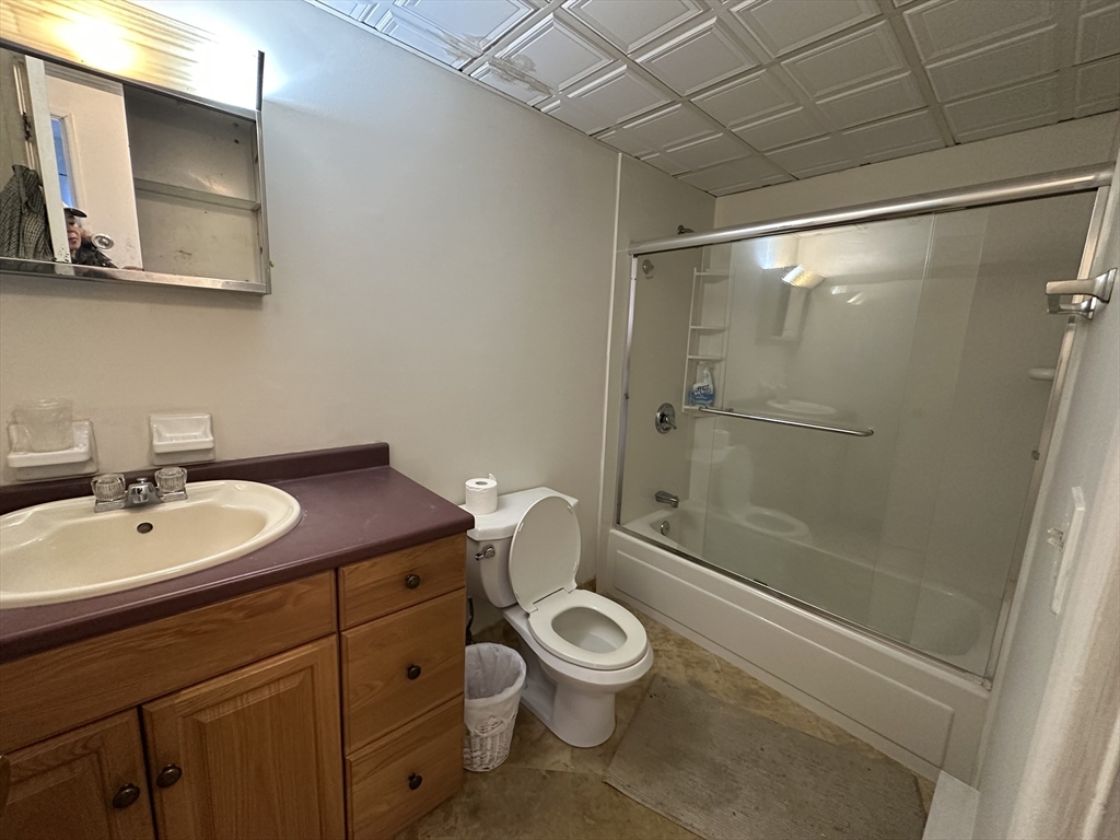 46 Cochituate Road, Unit 408 Framingham, MA 01701 - Photo 14 of 22 a bathroom with a sink a toilet and shower
