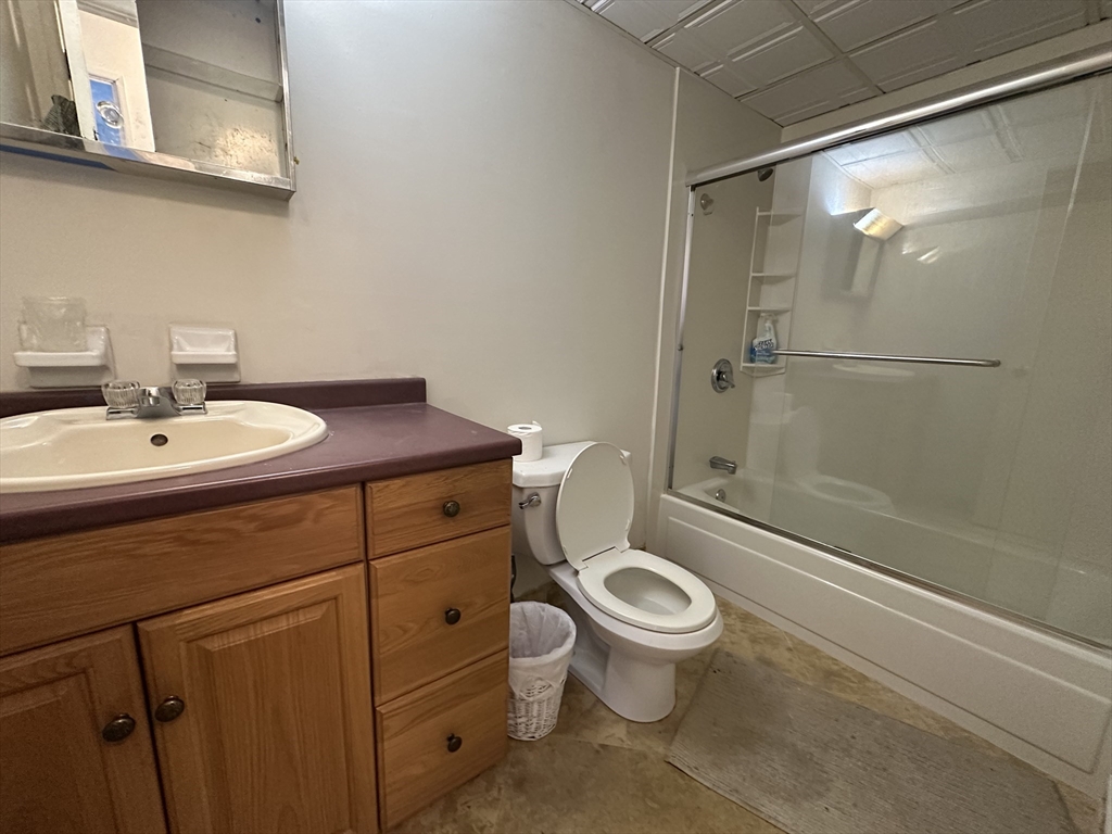 46 Cochituate Road, Unit 408 Framingham, MA 01701 - Photo 16 of 22 a bathroom with a sink a toilet and shower