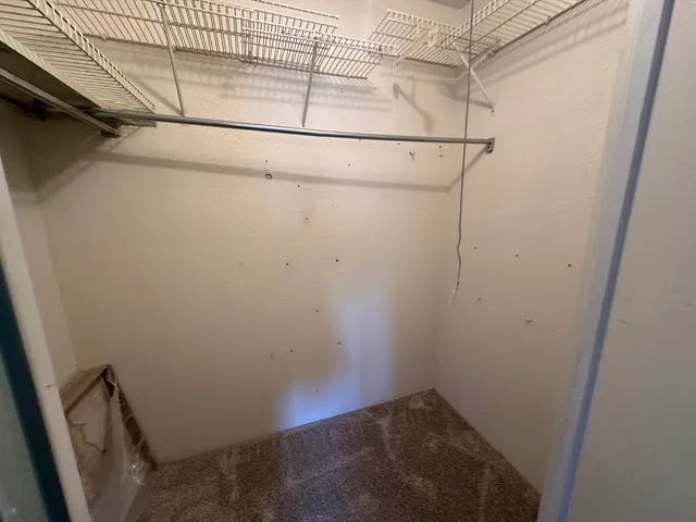 a view of a hallway with stairs