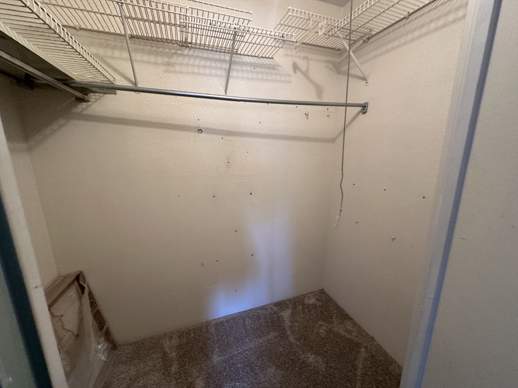 46 Cochituate Road, Unit 408 Framingham, MA 01701 - Photo 17 of 22 a view of small space with empty racks