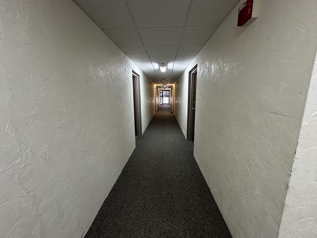 46 Cochituate Road, Unit 408 Framingham, MA 01701 - Photo 18 of 22 a view of a hallway with stairs