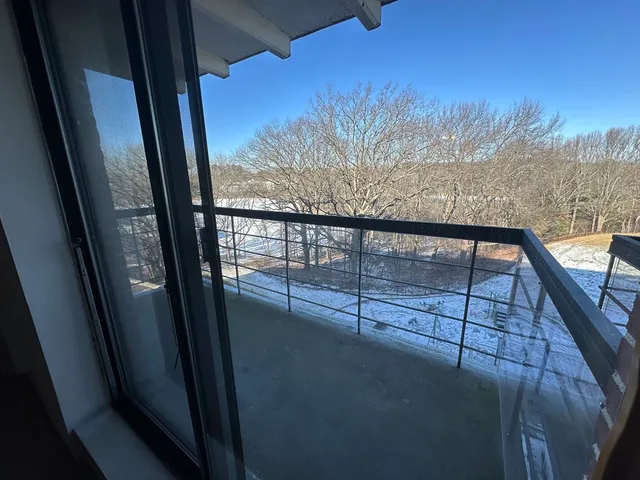 a view of a car parked on the side of the road