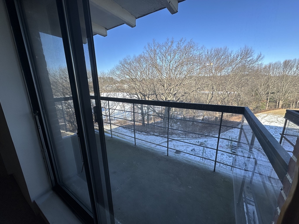 46 Cochituate Road, Unit 408 Framingham, MA 01701 - Photo 19 of 22 a view of a balcony with an outdoor space