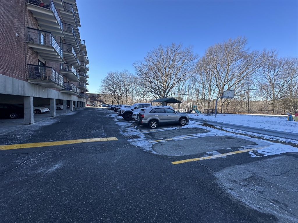 46 Cochituate Road, Unit 408 Framingham, MA 01701 - Photo 22 of 22 a view of road with large trees