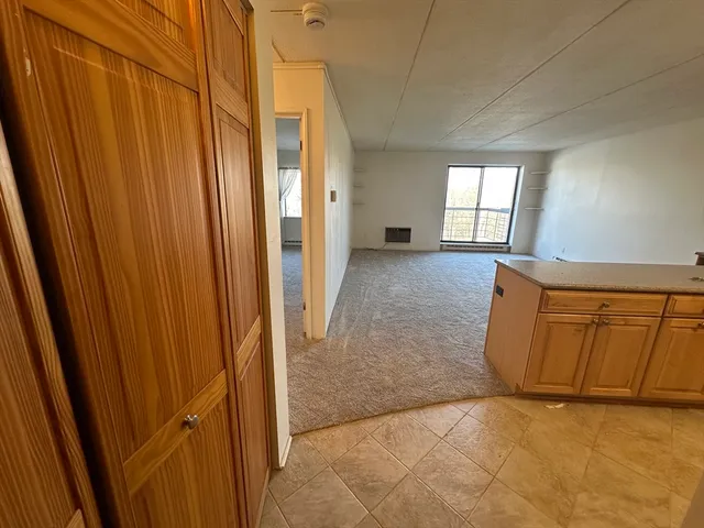 a view of a room with window and stairs