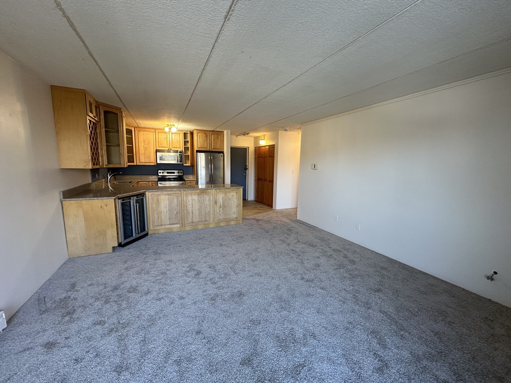 46 Cochituate Road, Unit 408 Framingham, MA 01701 - Photo 7 of 22 a view of a kitchen with a sink