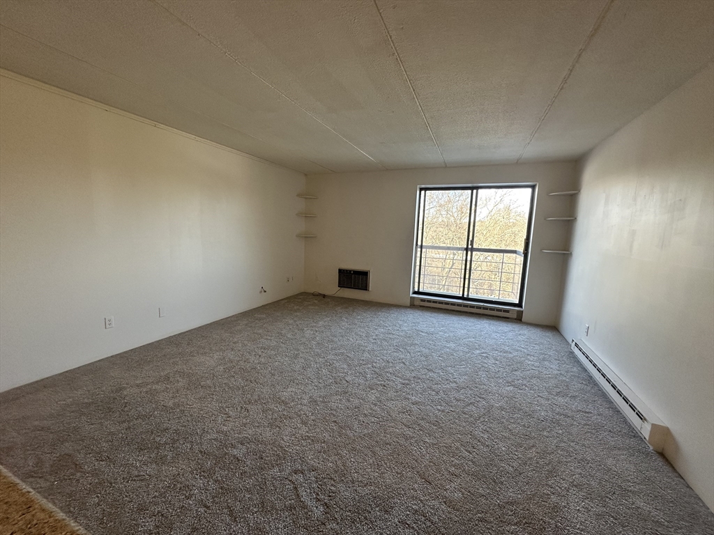 46 Cochituate Road, Unit 408 Framingham, MA 01701 - Photo 10 of 22 an empty room with windows
