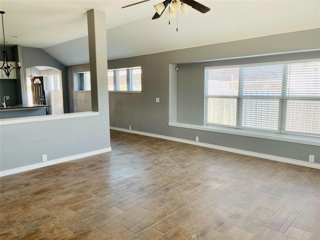 548 Kerry Street Crowley, TX 76036 - Photo 11 of 35 a view of an empty room with a window