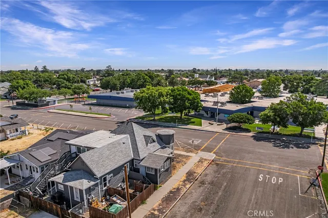 a front view of a house with wooden fence