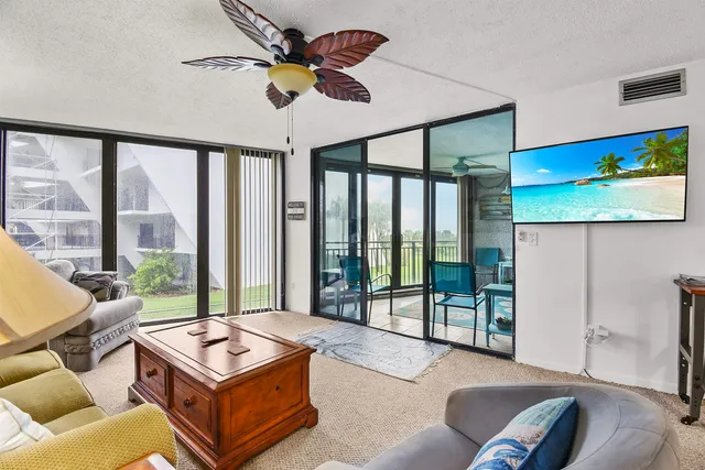 a bedroom with bed and a chandelier