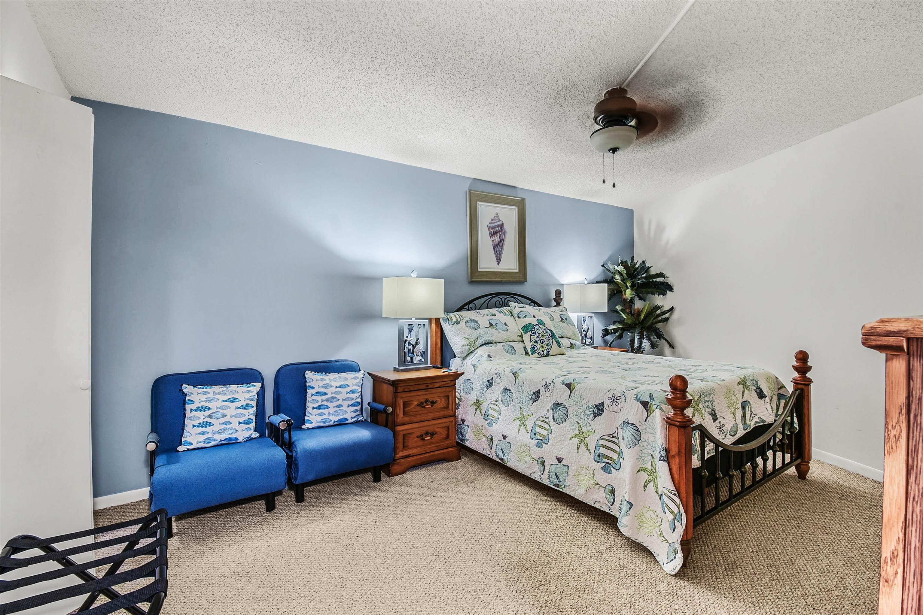 2 Dondanville Road, Unit 212 St. Augustine, FL 32080 - Photo 21 of 31 a bedroom with bed and a chandelier
