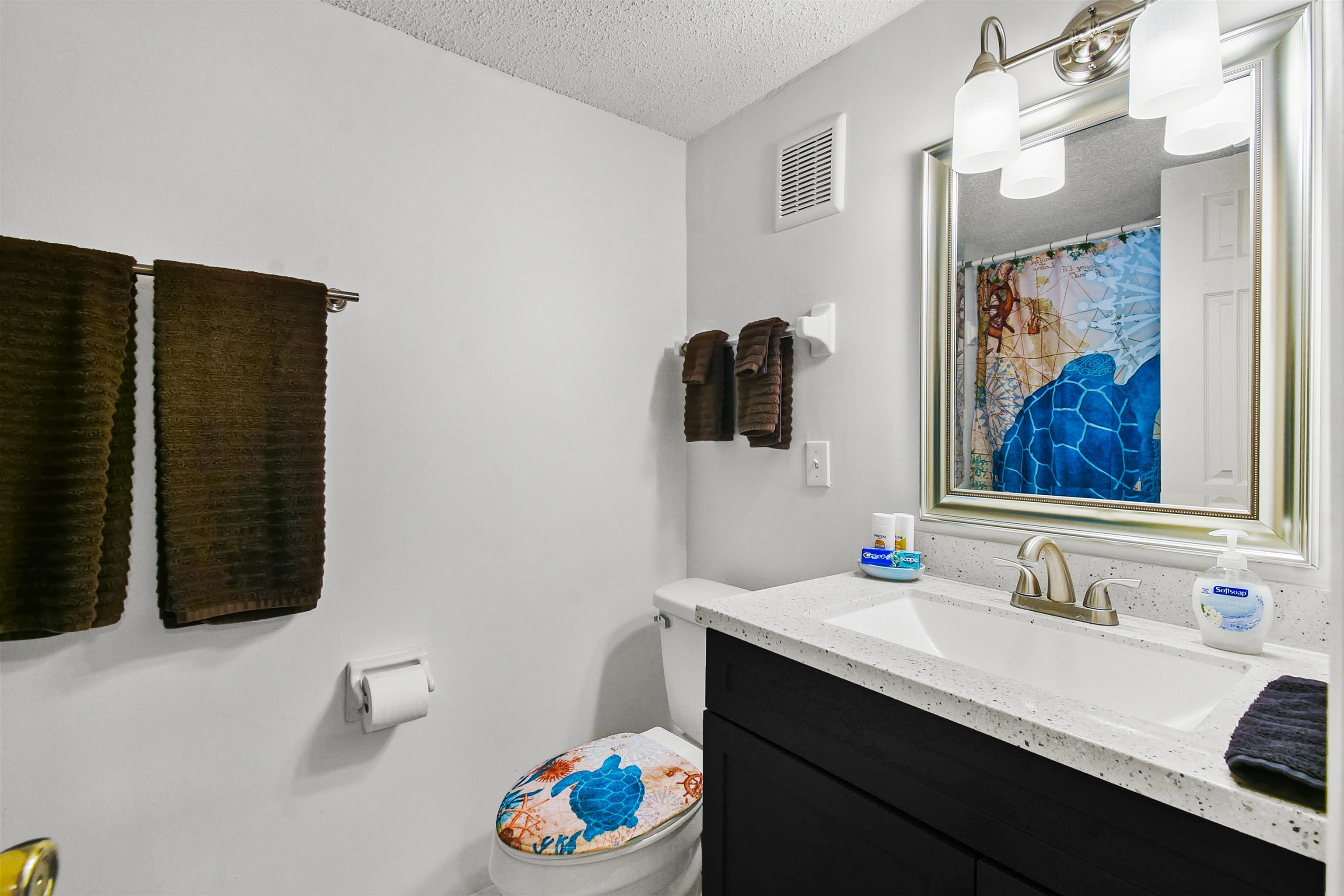 2 Dondanville Road, Unit 212 St. Augustine, FL 32080 - Photo 25 of 31 a bathroom with a sink and a mirror
