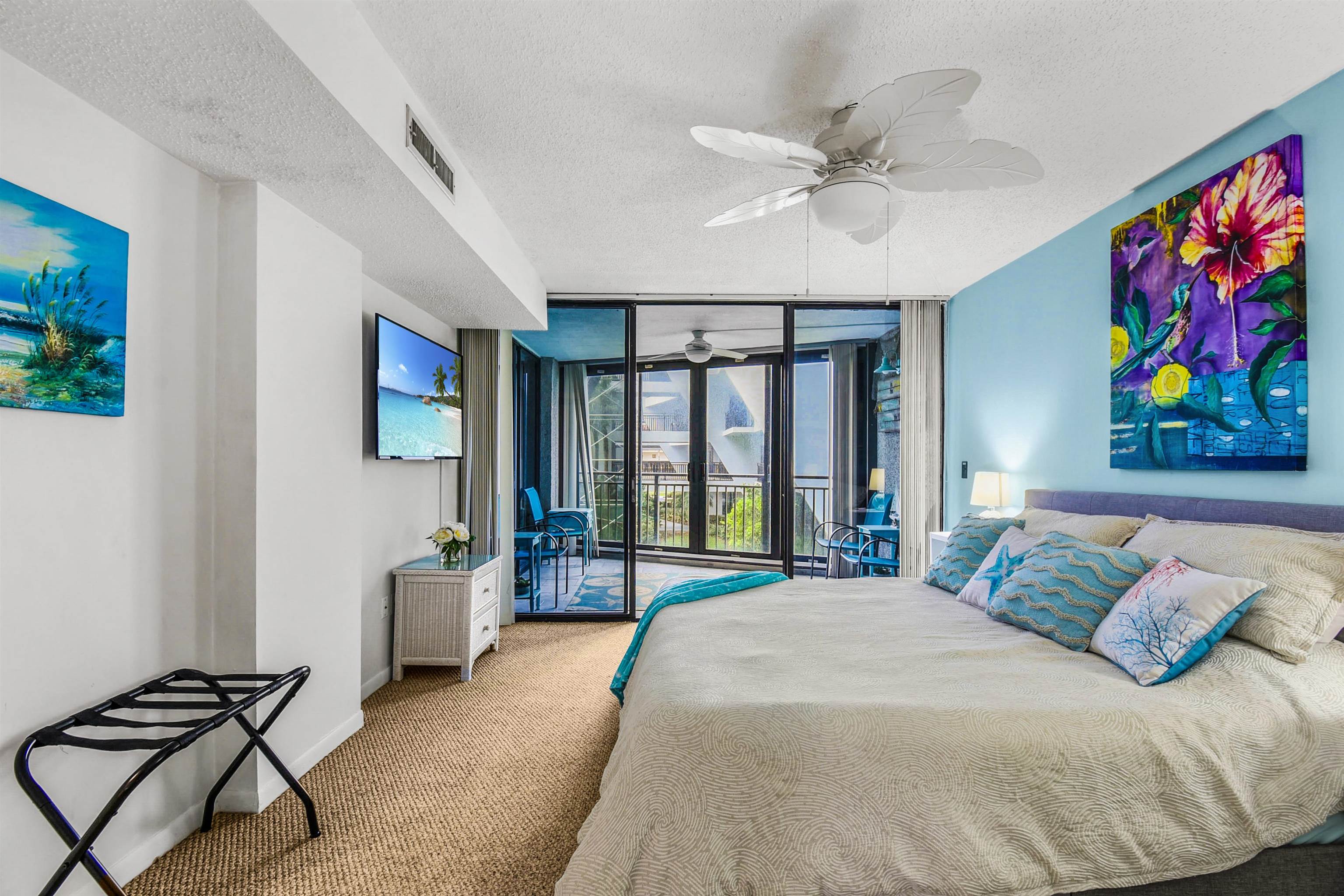 2 Dondanville Road, Unit 212 St. Augustine, FL 32080 - Photo 6 of 31 a bedroom with a bed and a chandelier