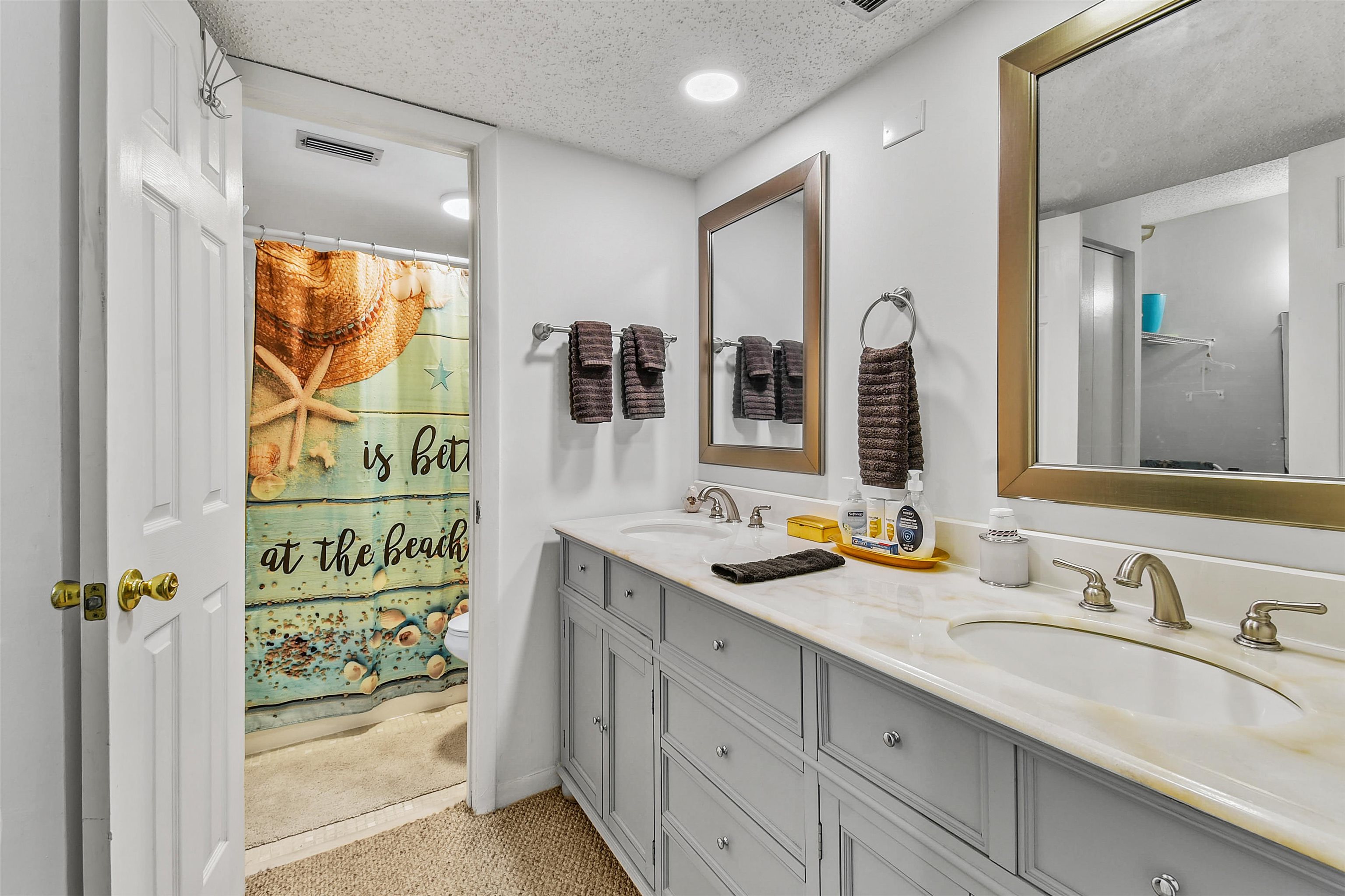 2 Dondanville Road, Unit 212 St. Augustine, FL 32080 - Photo 7 of 31 a bathroom with a sink and a mirror