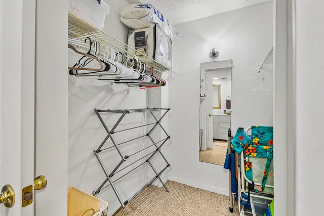 a living room with a balcony and furniture