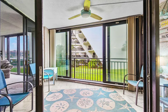 a view of a balcony with furniture