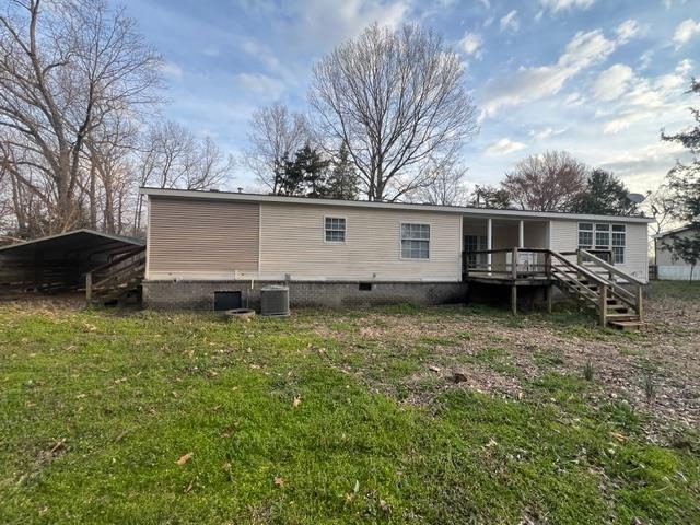 433 Robertson Road Mason, TN 38049 - Photo 12 of 12 a backyard of a house with barbeque oven and outdoor seating