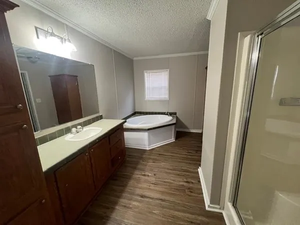 a bathroom with a double vanity sink and mirror