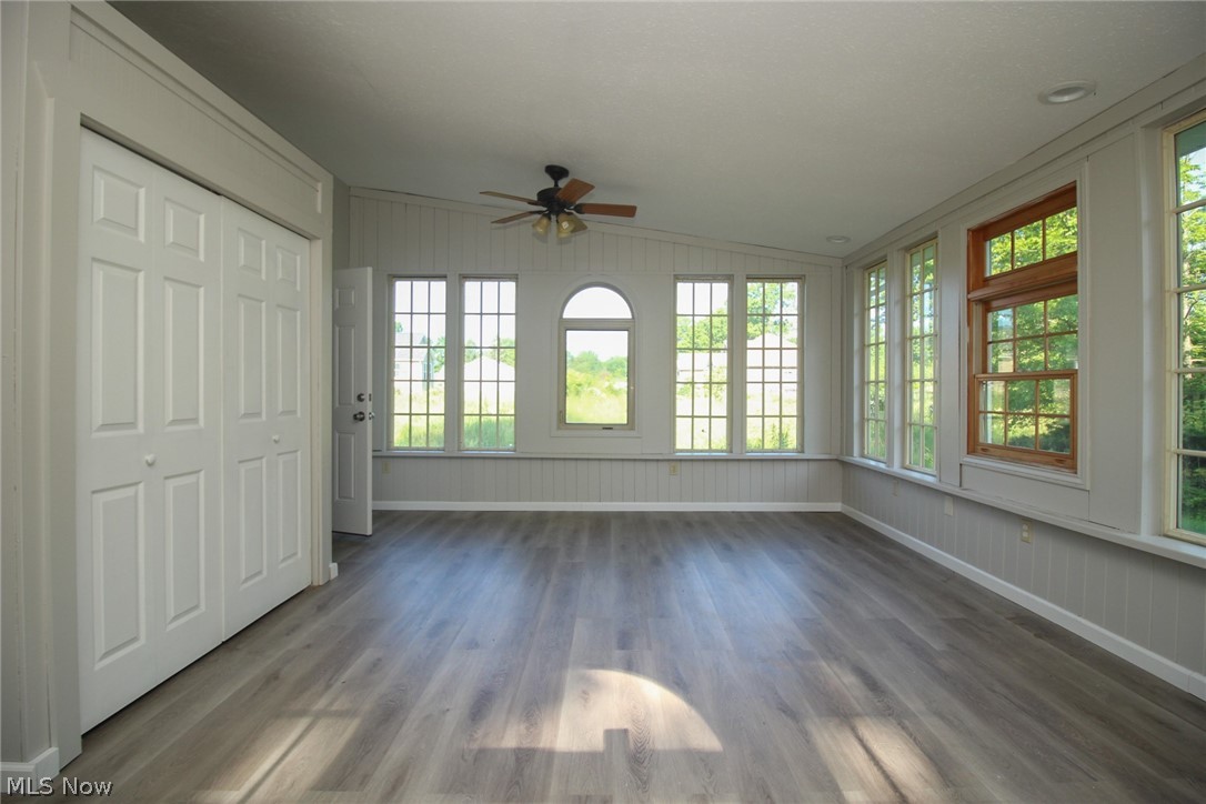 4113 Burgett Road Canfield, OH 44406 - Photo 7 of 31 Unfurnished sunroom with ceiling fan and lofted ceiling